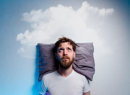 man on pillow looking upward